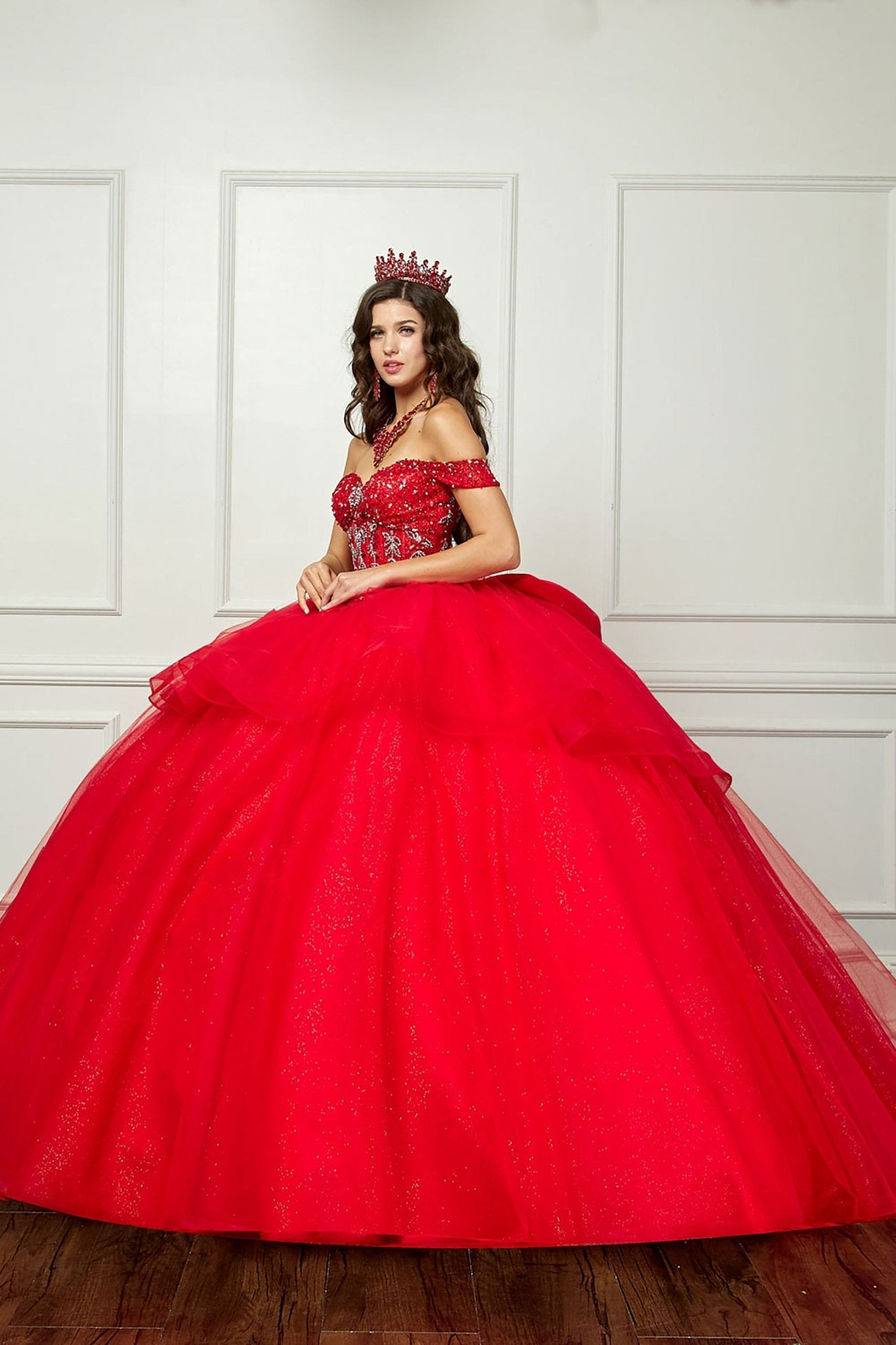 Red Quinceañera | Glittering Tulle Layers, Off-shoulder Bodice adornments, and a detachable bow | 3 Colors Available - side view of woman wearing dress and red crown