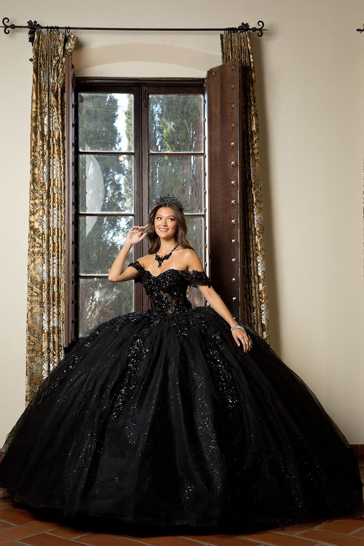 Bodice close-up highlights a black quinceañera ball gown with detachable sleeves, 3D floral applique, glitter details.