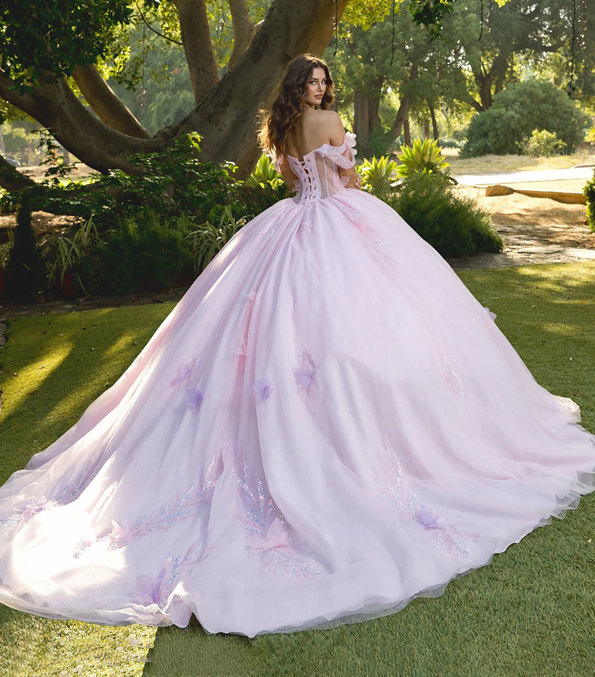 Back detail shows a pink wedding dress with corset bodice and floral embroidery.
