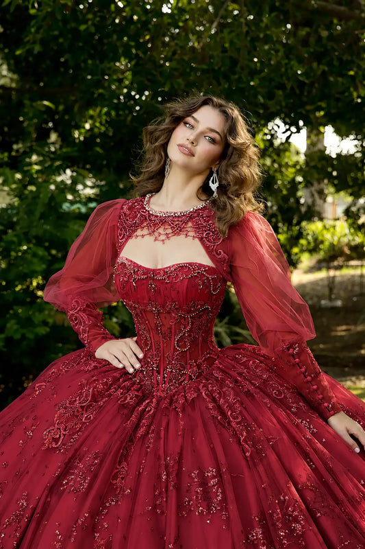 Woman in a red quinceanera dress with see though long sleeves
