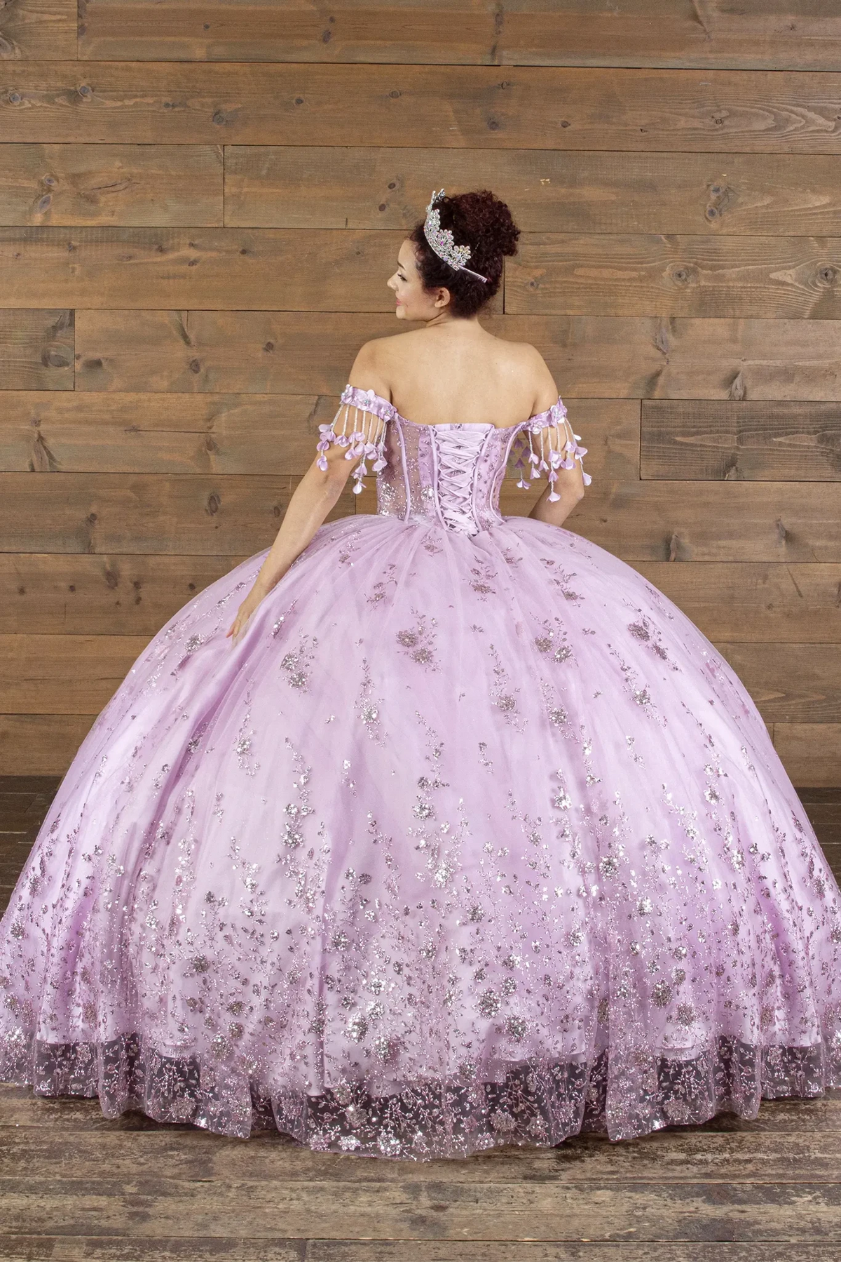 Lavender quinceañera ball gown with lace‑up corset back, butterfly applique and layered tulle skirt