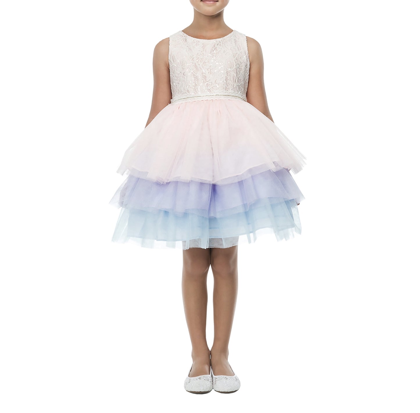 Young girl wearing a white lace top and pastel multicolor skirt on a white background
