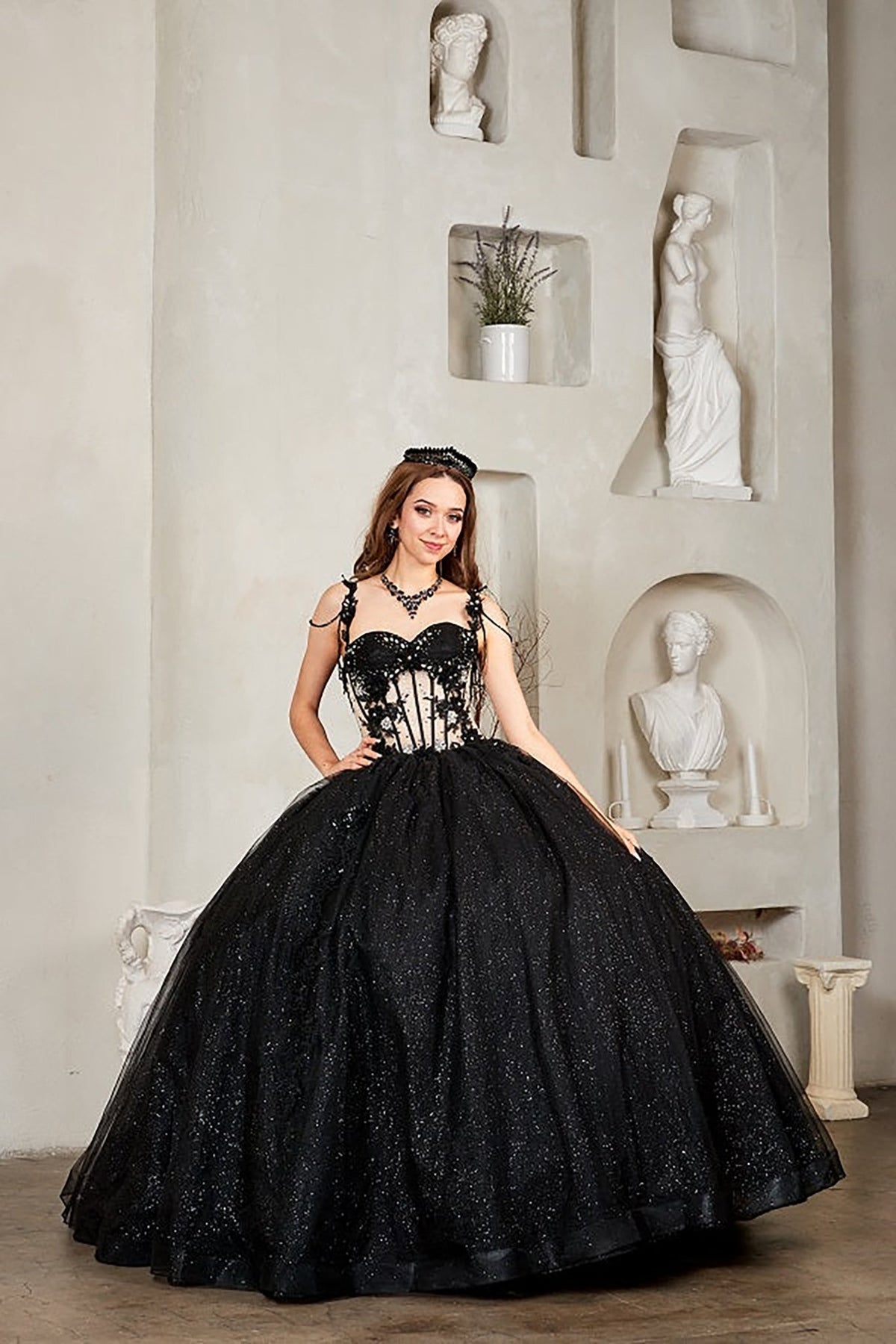 Intricate features stand out across black quinceañera ball gown with sheer corset bodice, 3D floral embroidery, detachable bow.