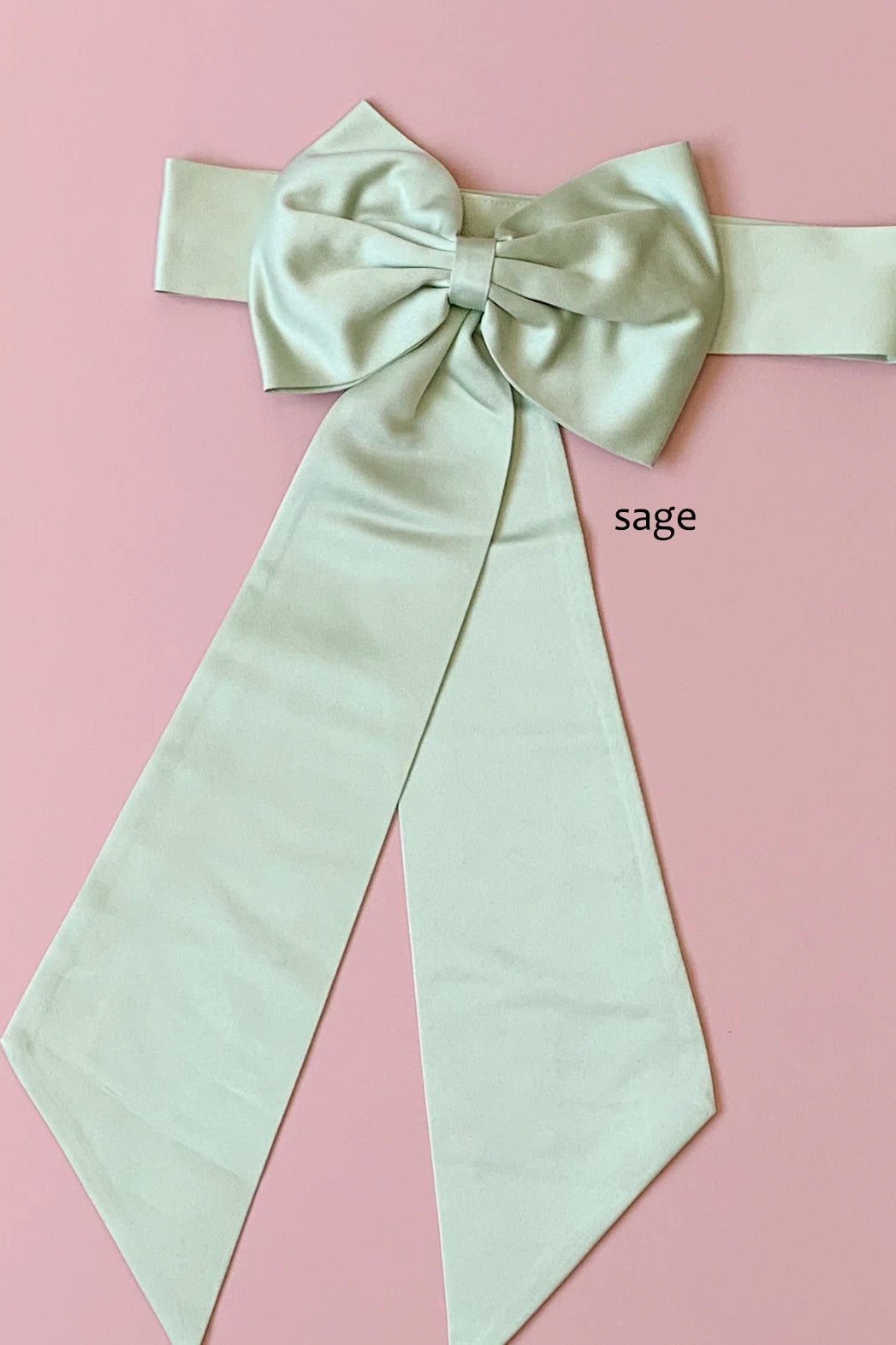 Polished details complete sage satin flower girl sash belt.