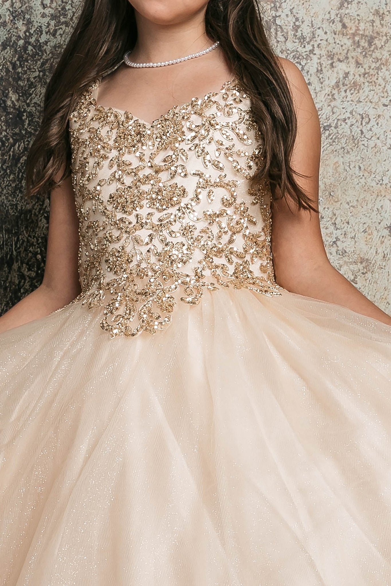 Zoomed front view of a champagne kids mini quinceanera dress highlighting sequin beaded embroidery bodice and glitter tulle skirt