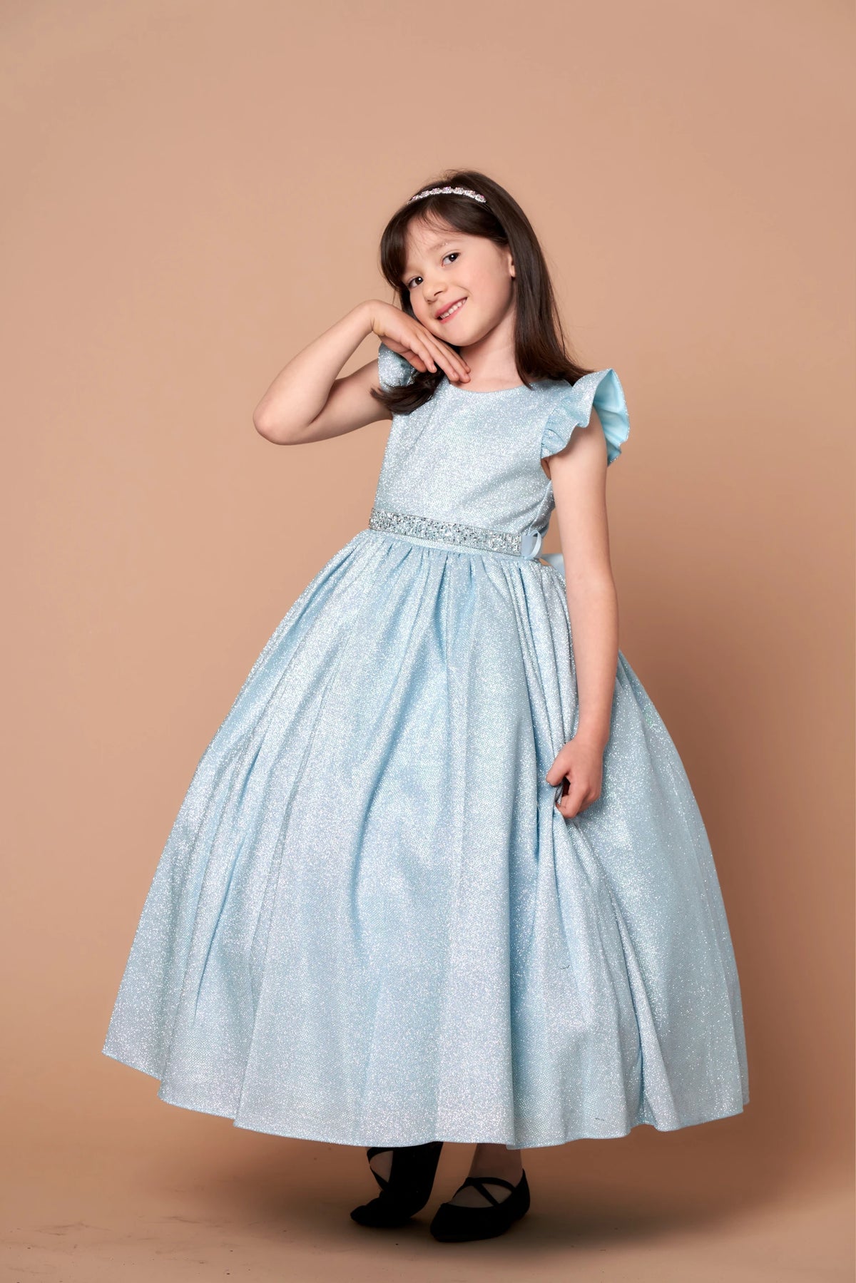 Seen at full length, the Light Blue mini quince dress showcases metallic full-length party silhouette and ruffle sleeves with a removable rhinestone belt.