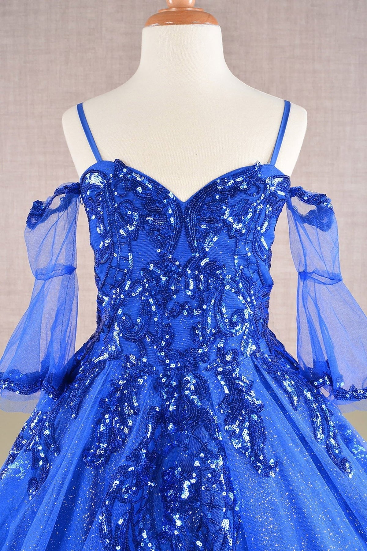 Close-up view reveals blue Royal Blue Kids Dress with Glitter Sequin Mesh and Detachable Sleeves, Mini Quince Dress.