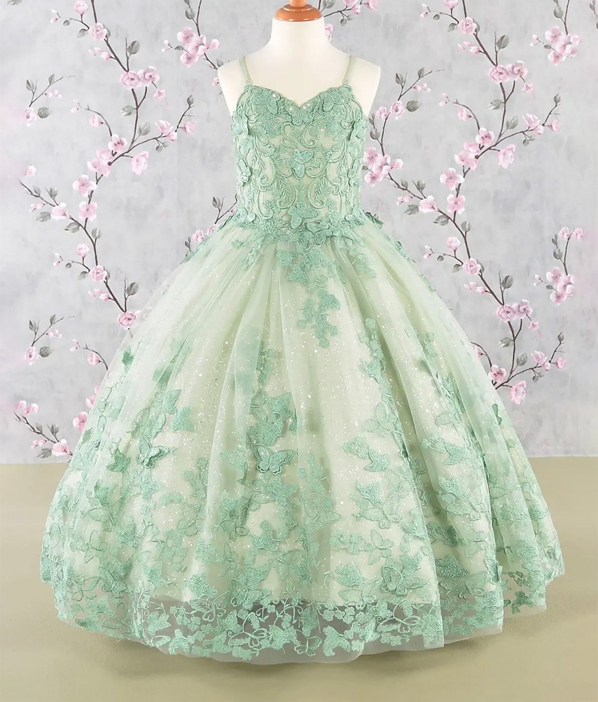 Intricate features stand out across Sage Green lace mini quince dress showcased.