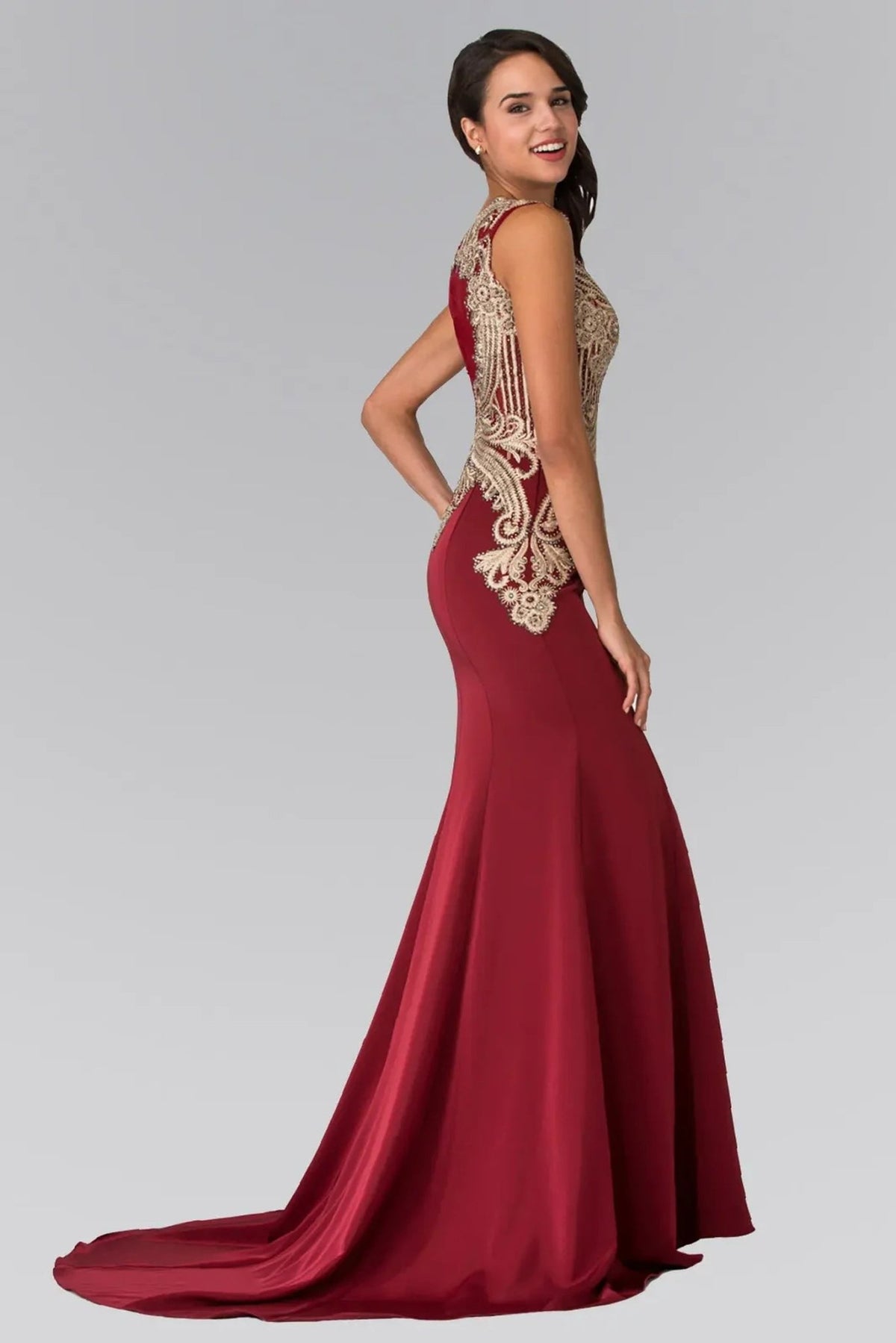 Rear view reveals burgundy embellished embroidery formal dress.