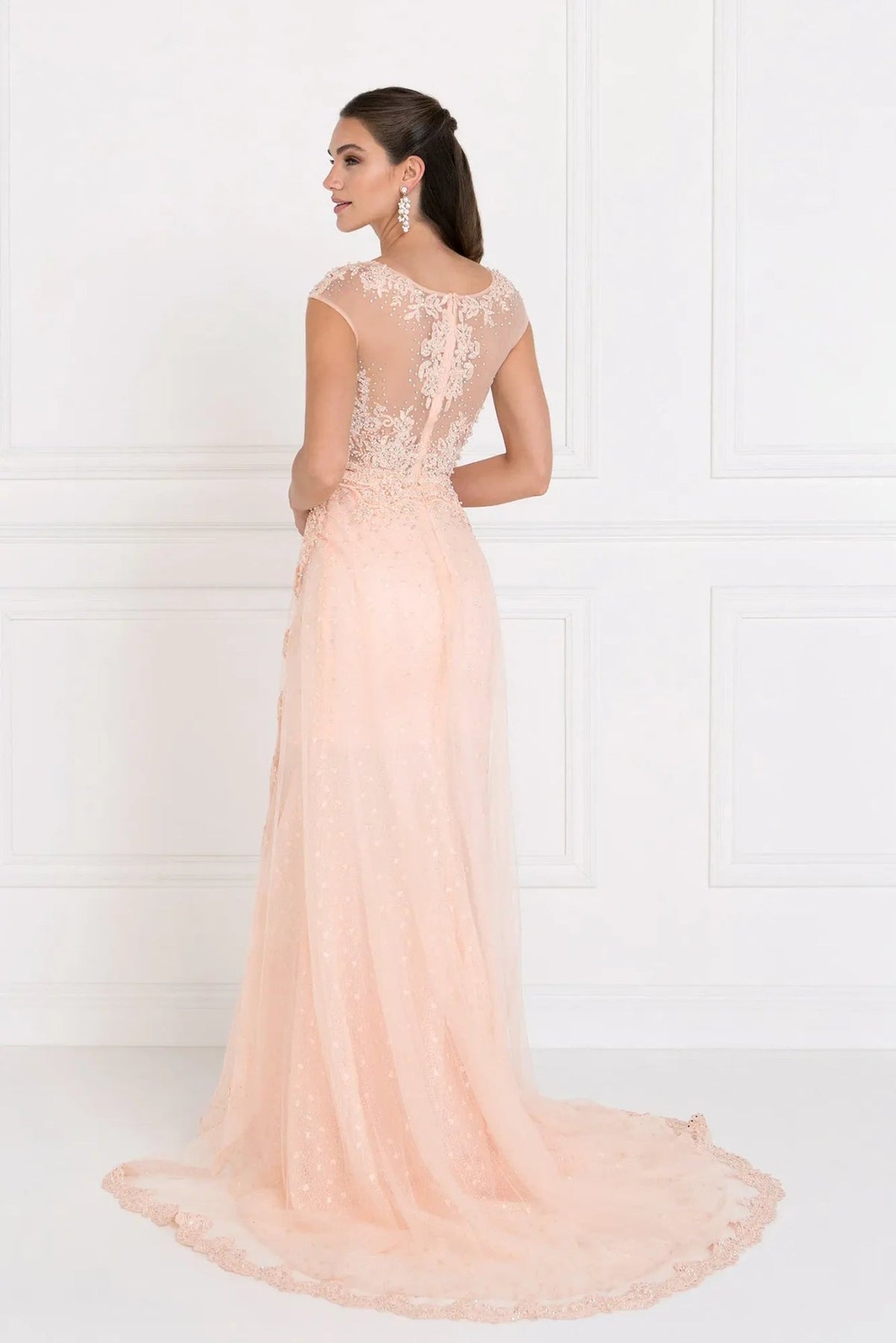 Bodice close-up highlights blush beading embellished embroidery formal dress.