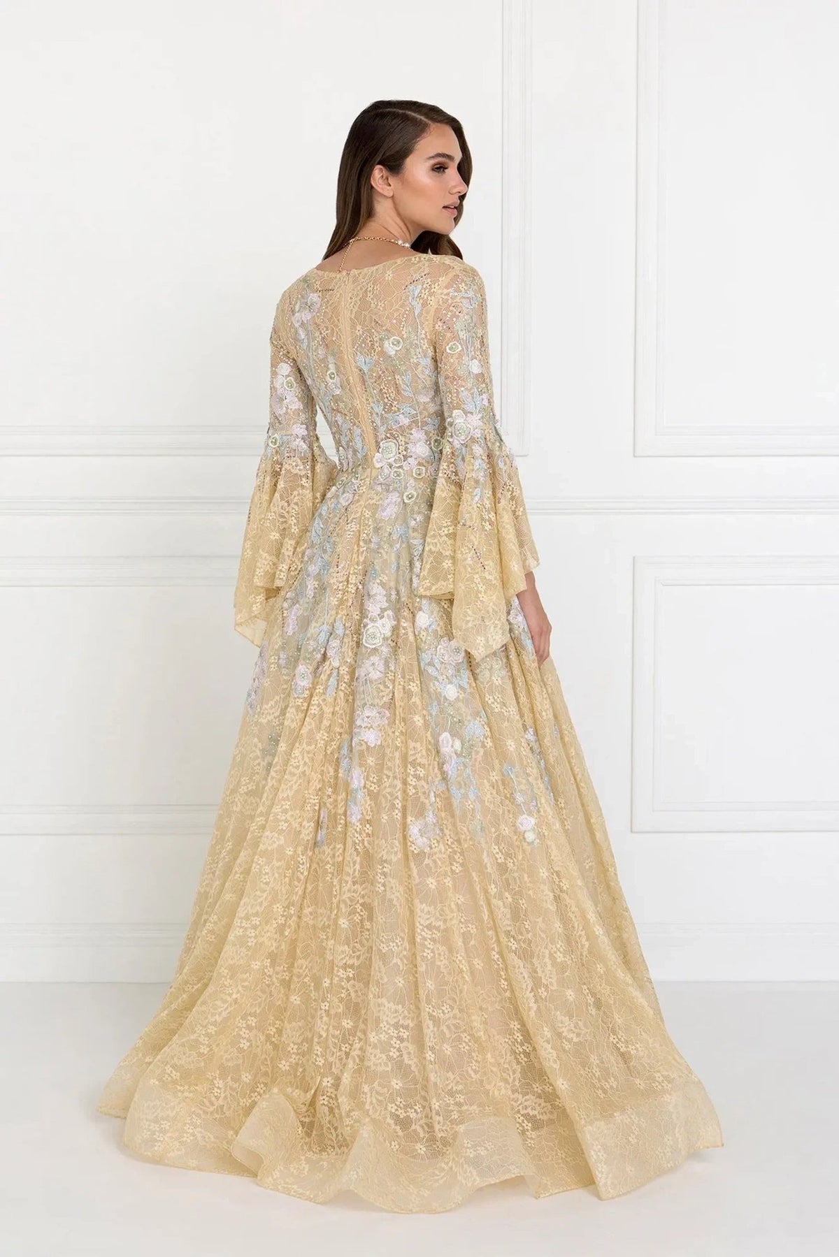Back detail shows champagne embellished embroidery floral formal dress back bodice detail.