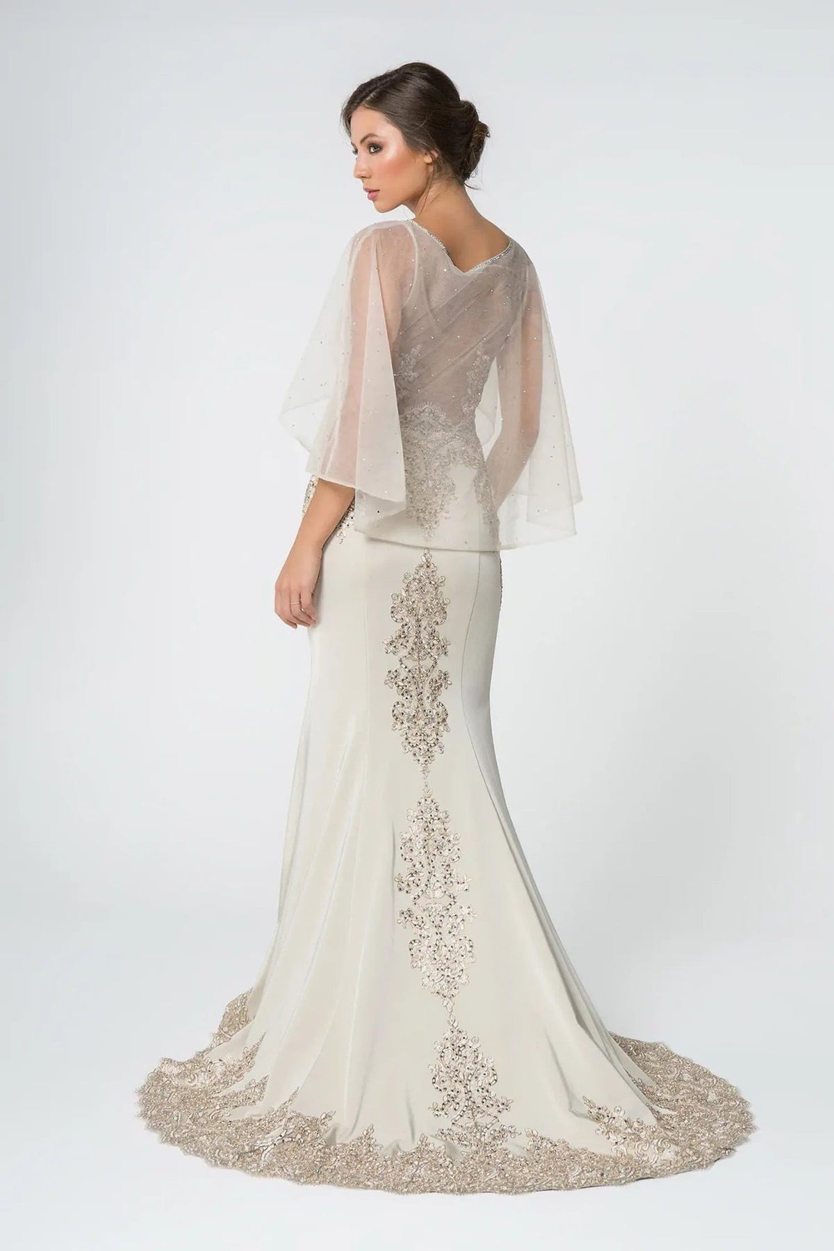 Side profile shows champagne embellished embroidery formal dress side detail.