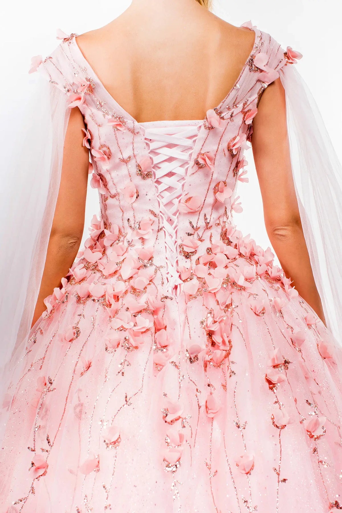 Detachable accents complete the Blush quinceañera ball gown with detachable cape sleeves.