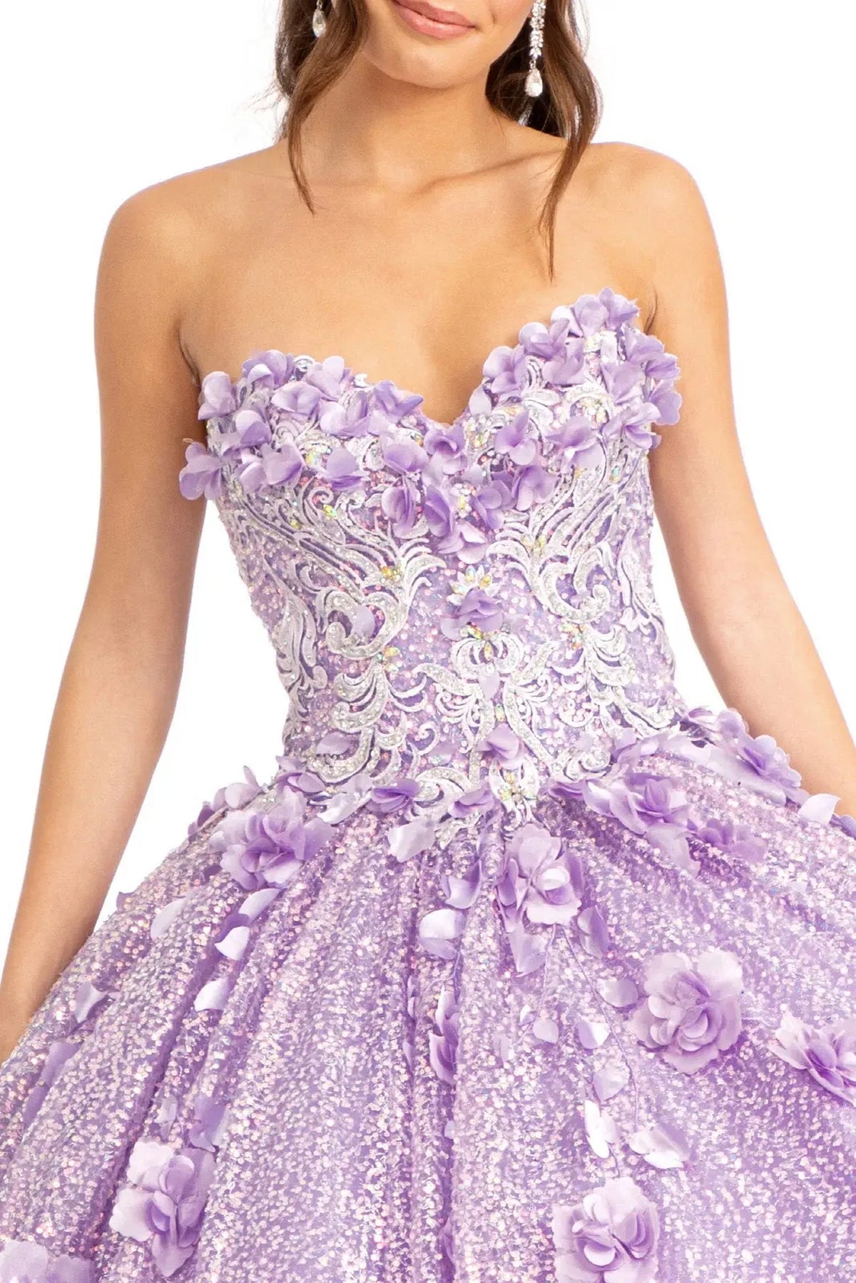 Layered skirt showcases the Lilac quinceañera ball gown with 3d floral appliqués.