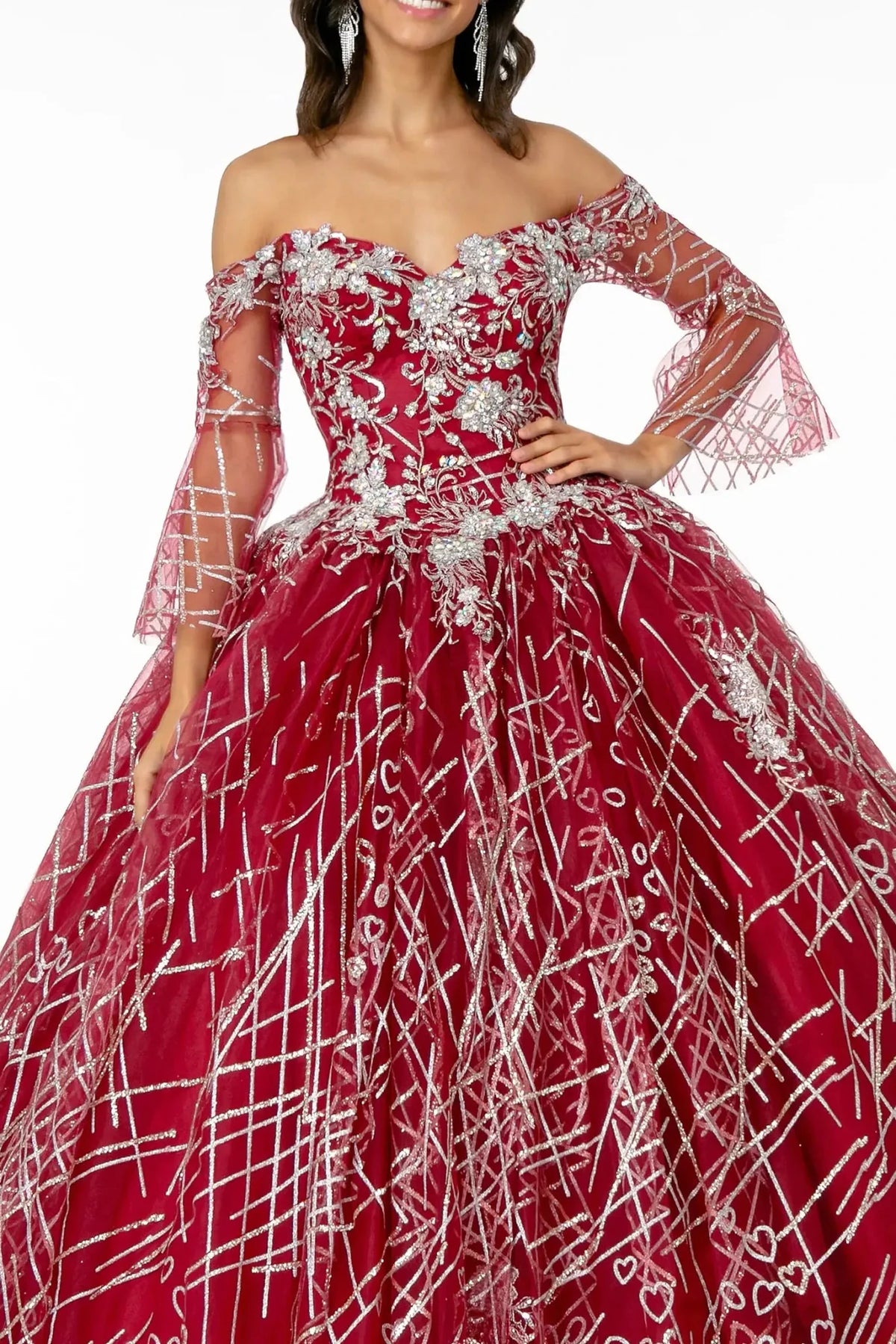 The Burgundy quinceañera dress comes into focus in a front bodice close-up, showing silver floral lace across the off-shoulder corset.