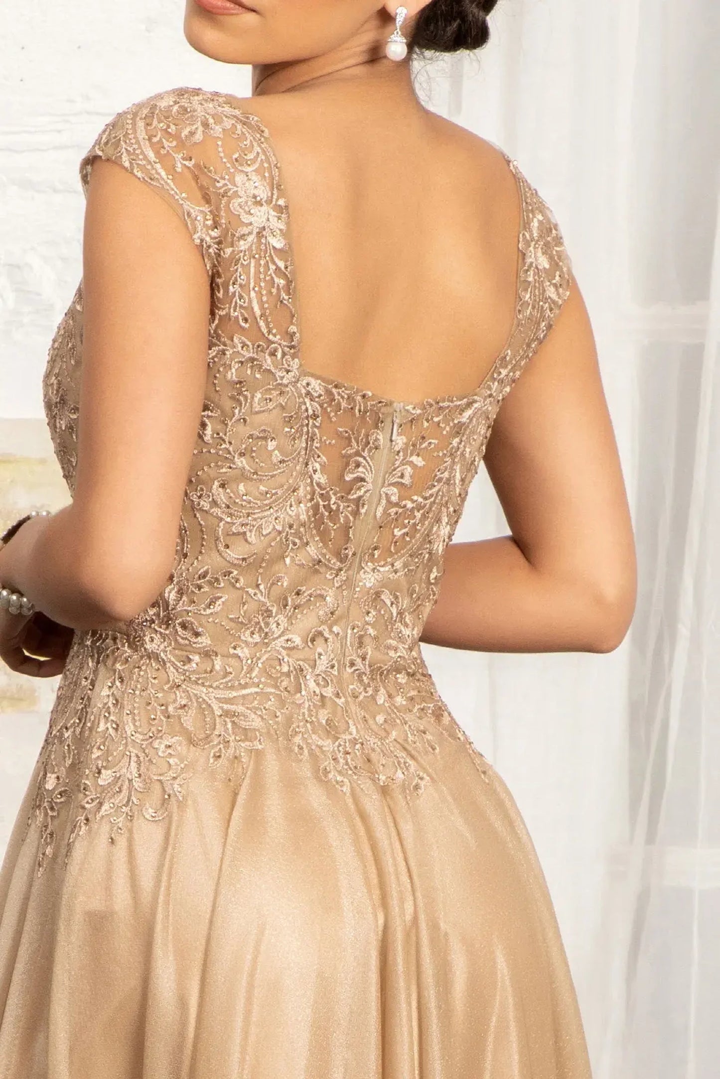 Gold mother of the bride dress featuring concealed zipper back bodice finished with beads, embroidery