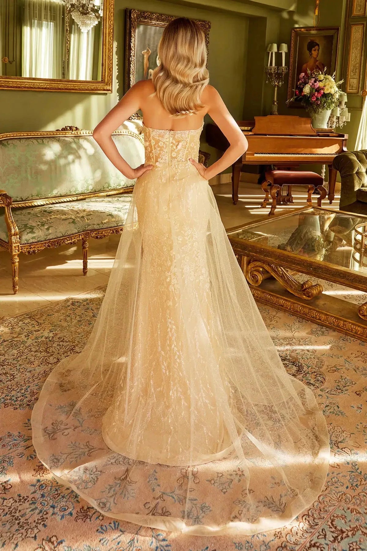 Rear view reveals Champagne Jewel mermaid mother of the bride dress with open back and strapless.