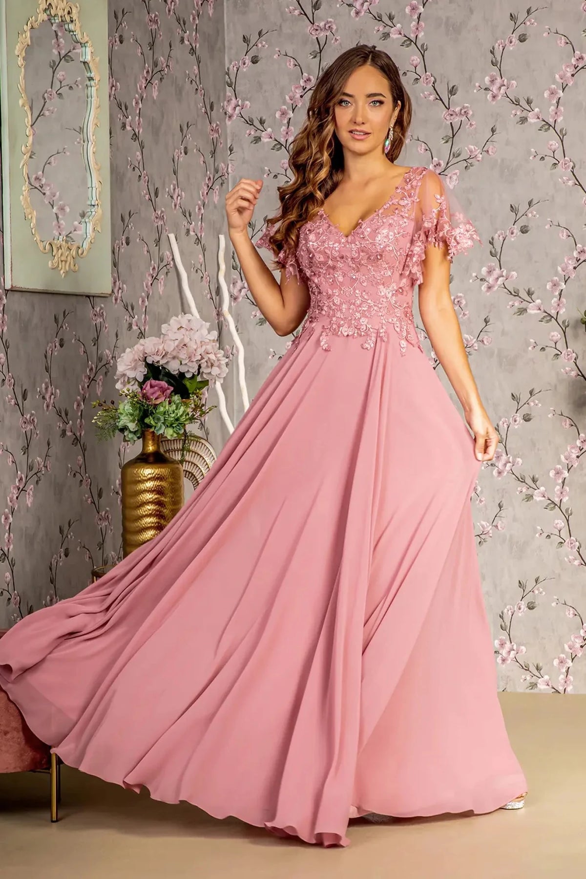 Detailed view highlights dusty Rose chiffon a-line mother of the bride dress with sweetheart.