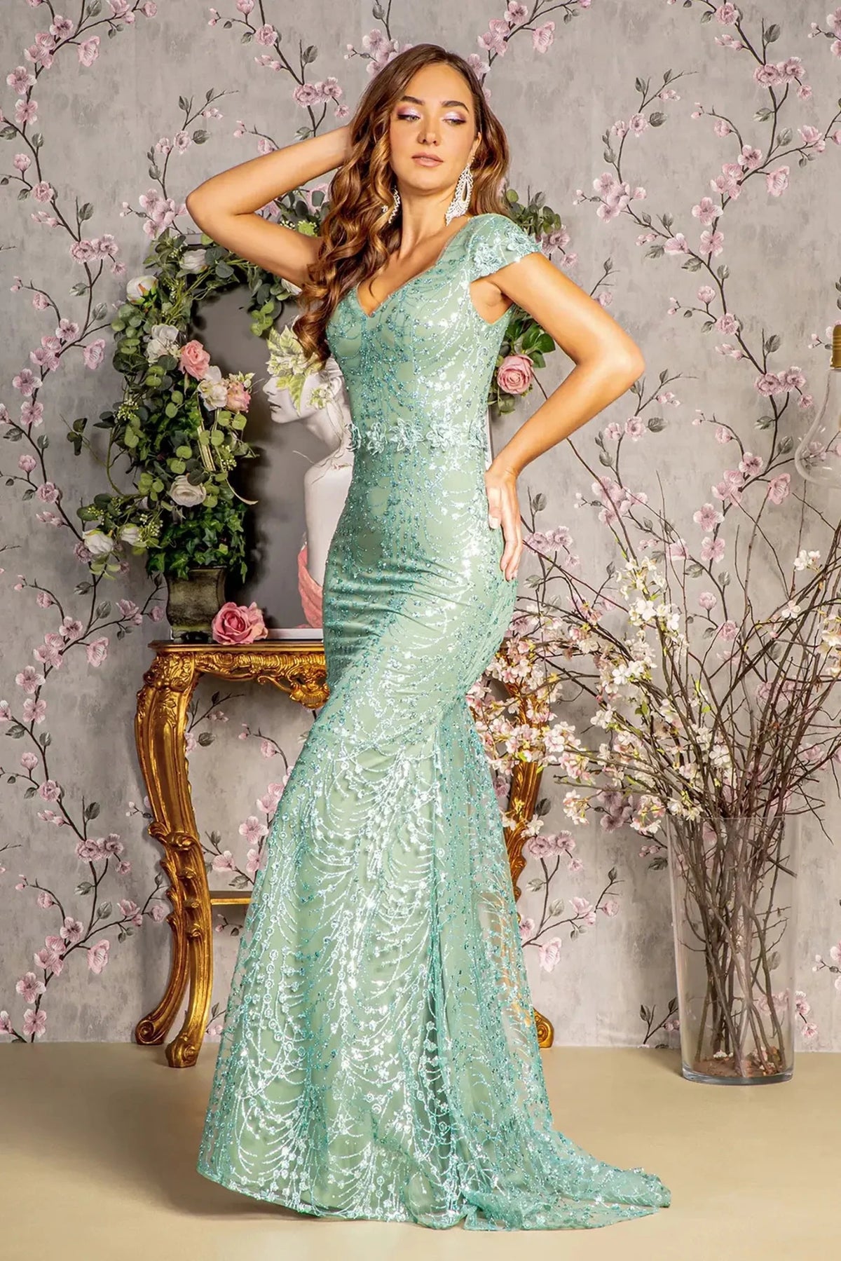 Detailed view highlights sage mesh mermaid mother of the bride dress with sweetheart.