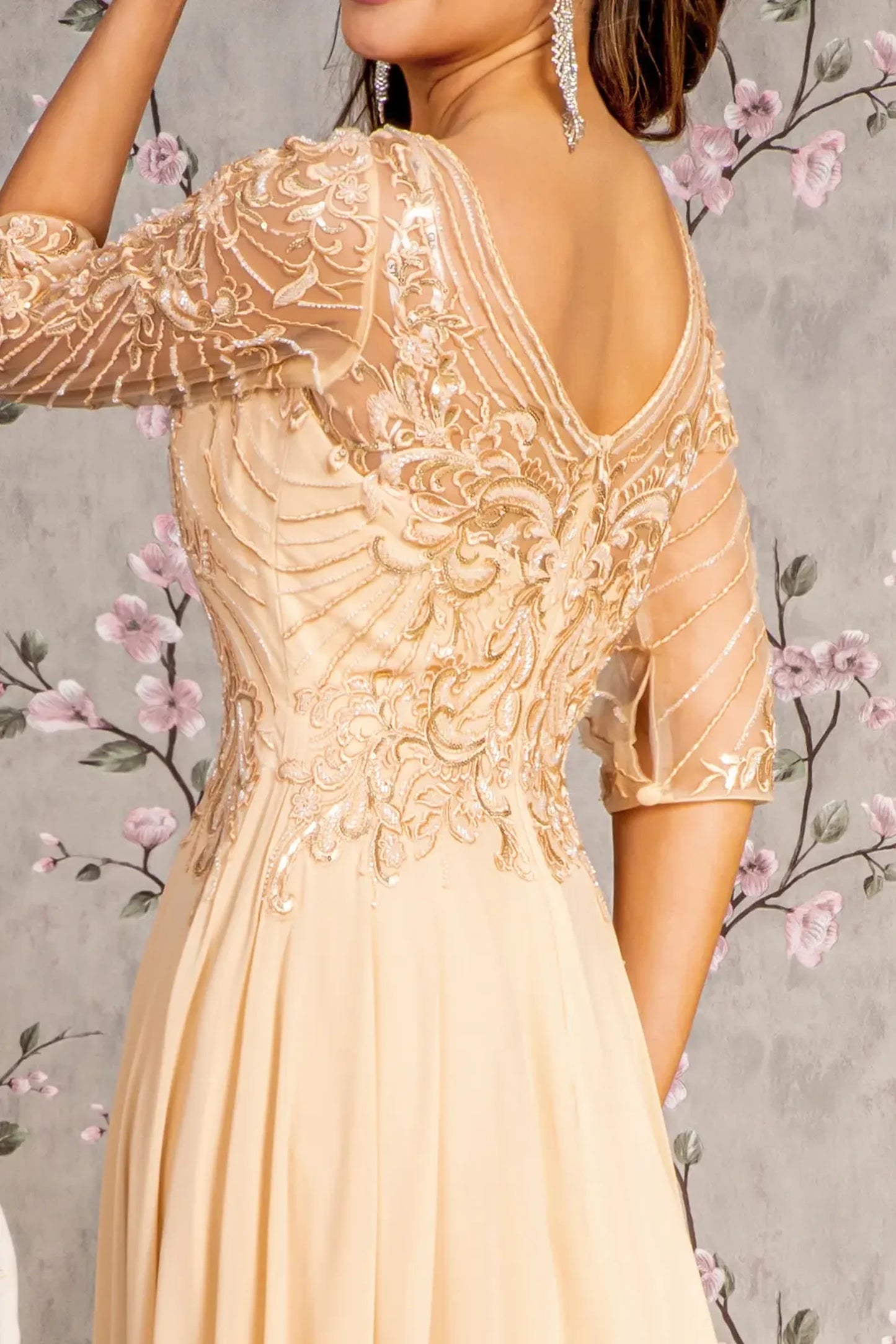 Champagne mother of the bride dress featuring v-back with concealed zipper bodice finished with beads, embroidery, metallic, sequin