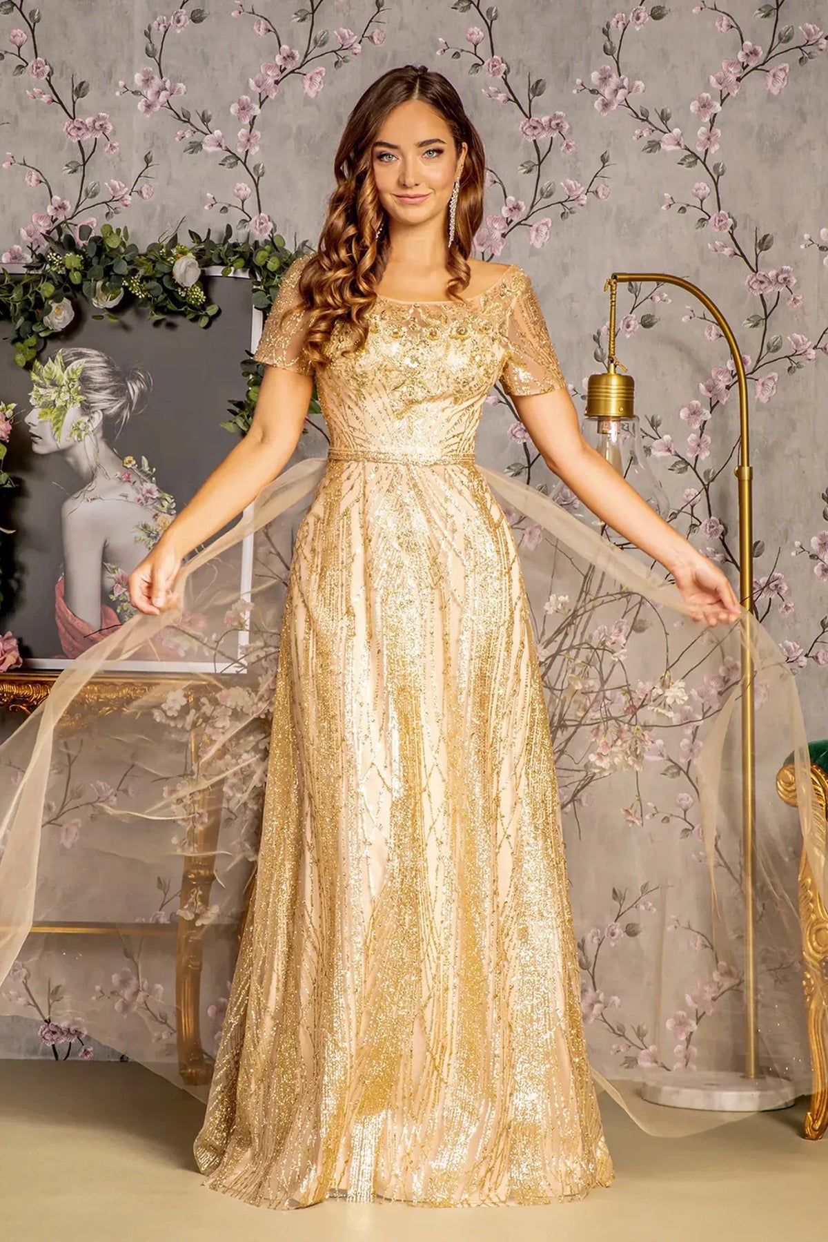 Detailed view highlights gold mesh a-line mother of the bride dress with boat-neck.