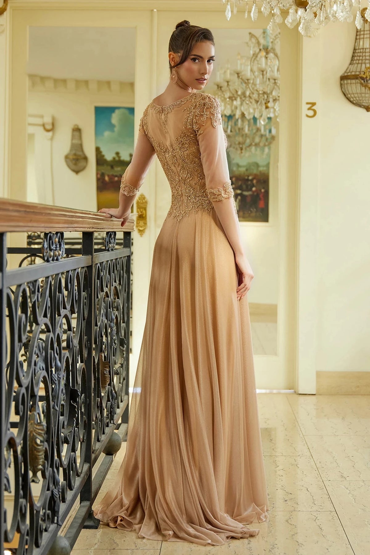 Rear view reveals Gold Jeweled a-line mother of the bride dress with concealed zipper back and 3/4 sleeve.