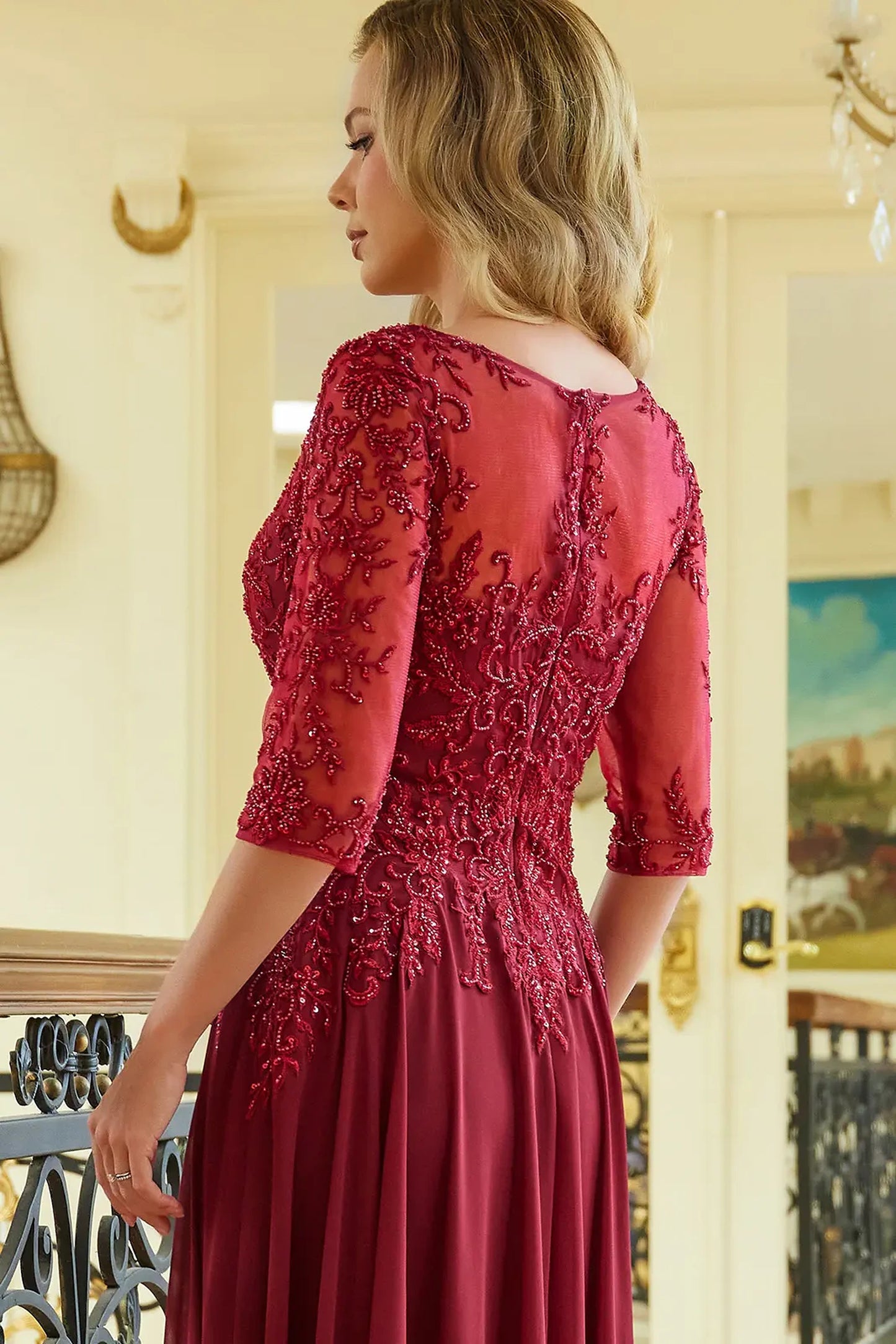 Burgundy mother of the bride dress featuring concealed zipper back bodice finished with beads, embroidery, sequin