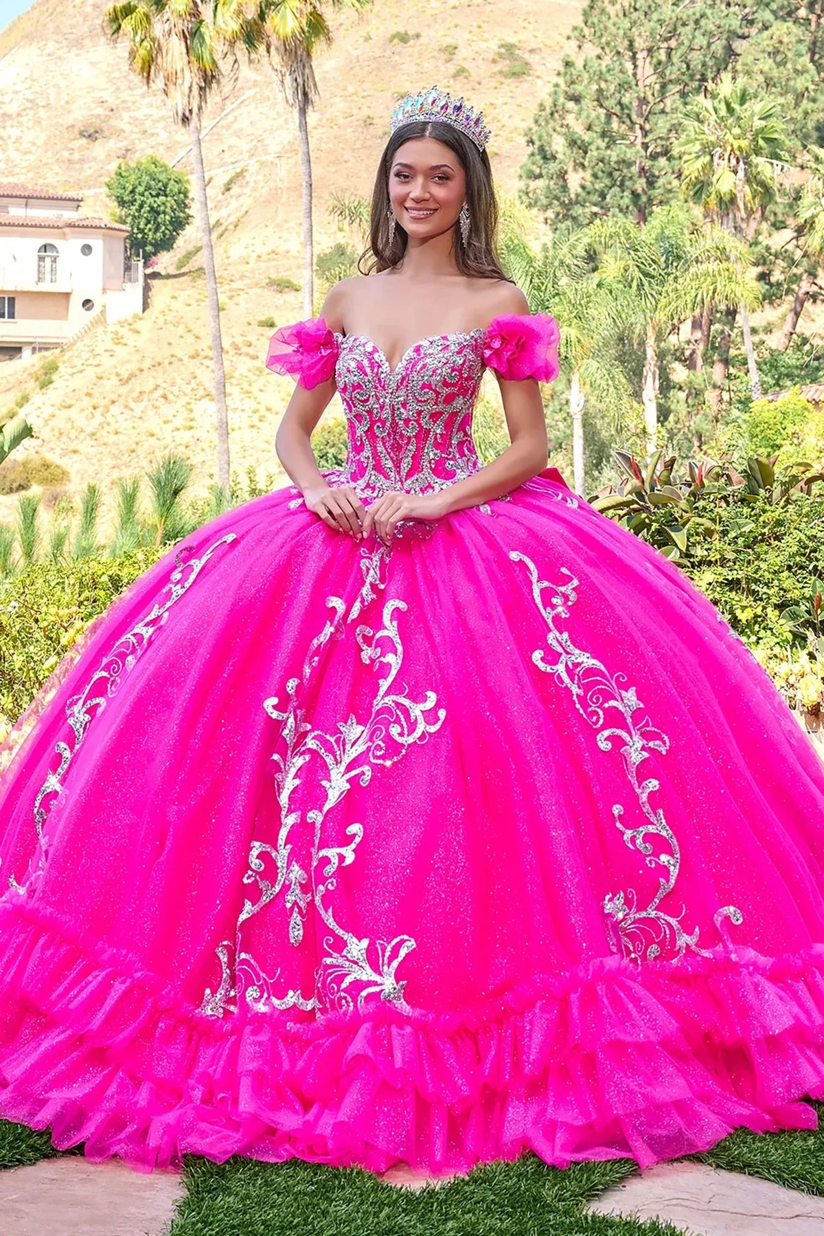 Bodice close-up highlights fuchsia quinceañera dress with floral embroidery puff sleeves butterfly applique corset bodice ball gown.