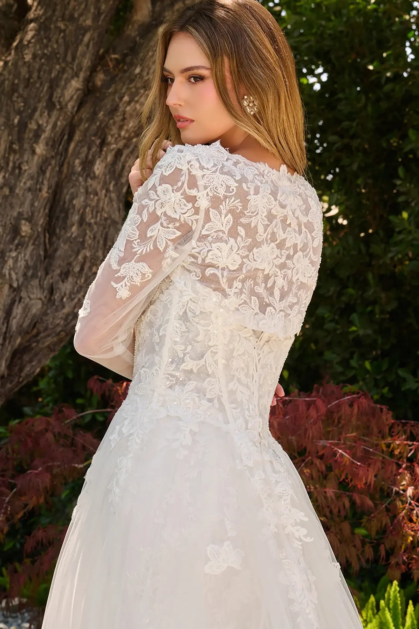 Off-white wedding dress with bolero shrug fitted silhouette and embroidered florals