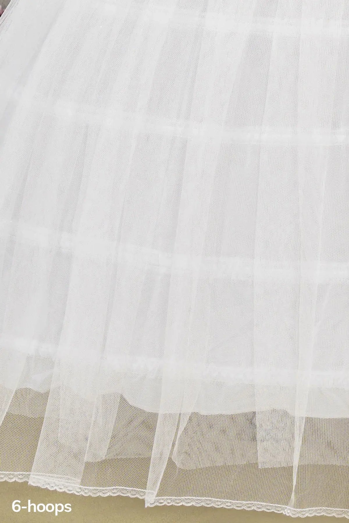 Hoop structure shapes the White quinceañera petticoat with 6-hoop tulle.