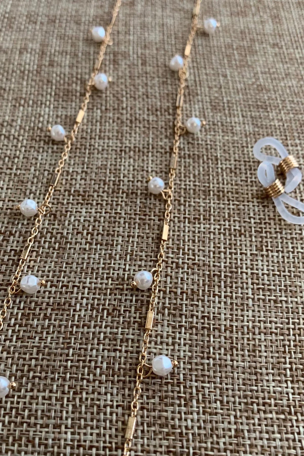 Close-up view reveals pearl 14K Gold Plated-plated everyday women's reading glasses chain.