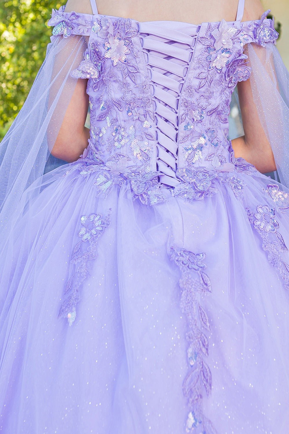 Purple ball gown with floral details and a tulle skirt.