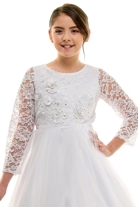 Young girl wearing a white lace dress with long sleeves on a white background