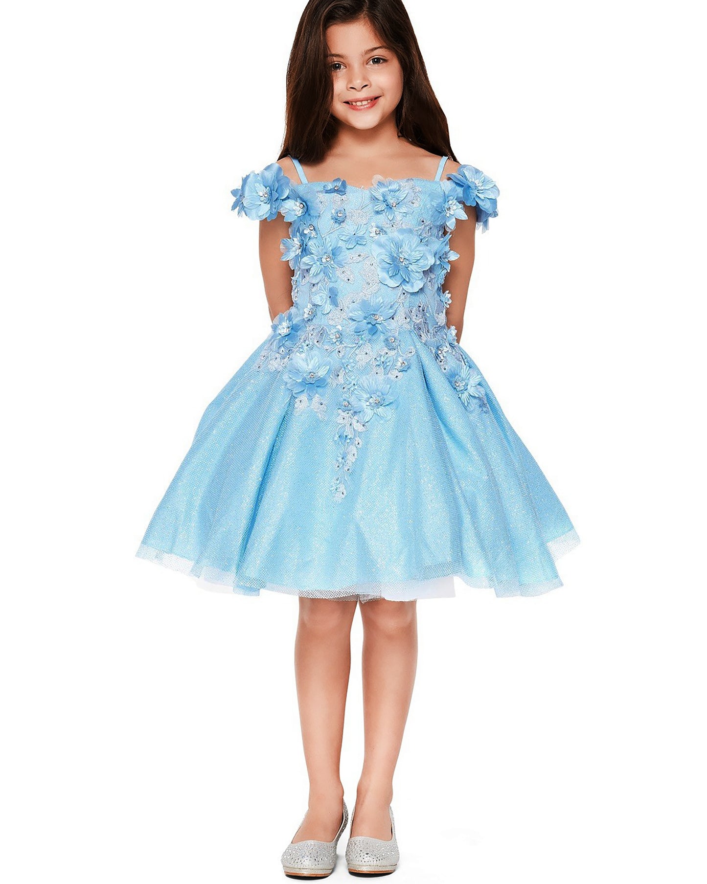Young girl wearing a light blue floral dress on a white background