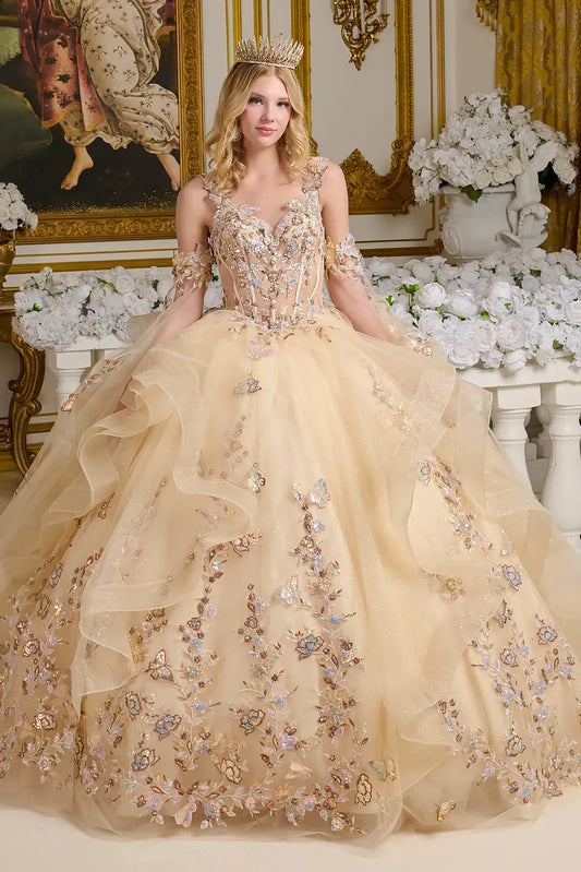 Woman in a beige embroidered gown with floral details in an ornate room.