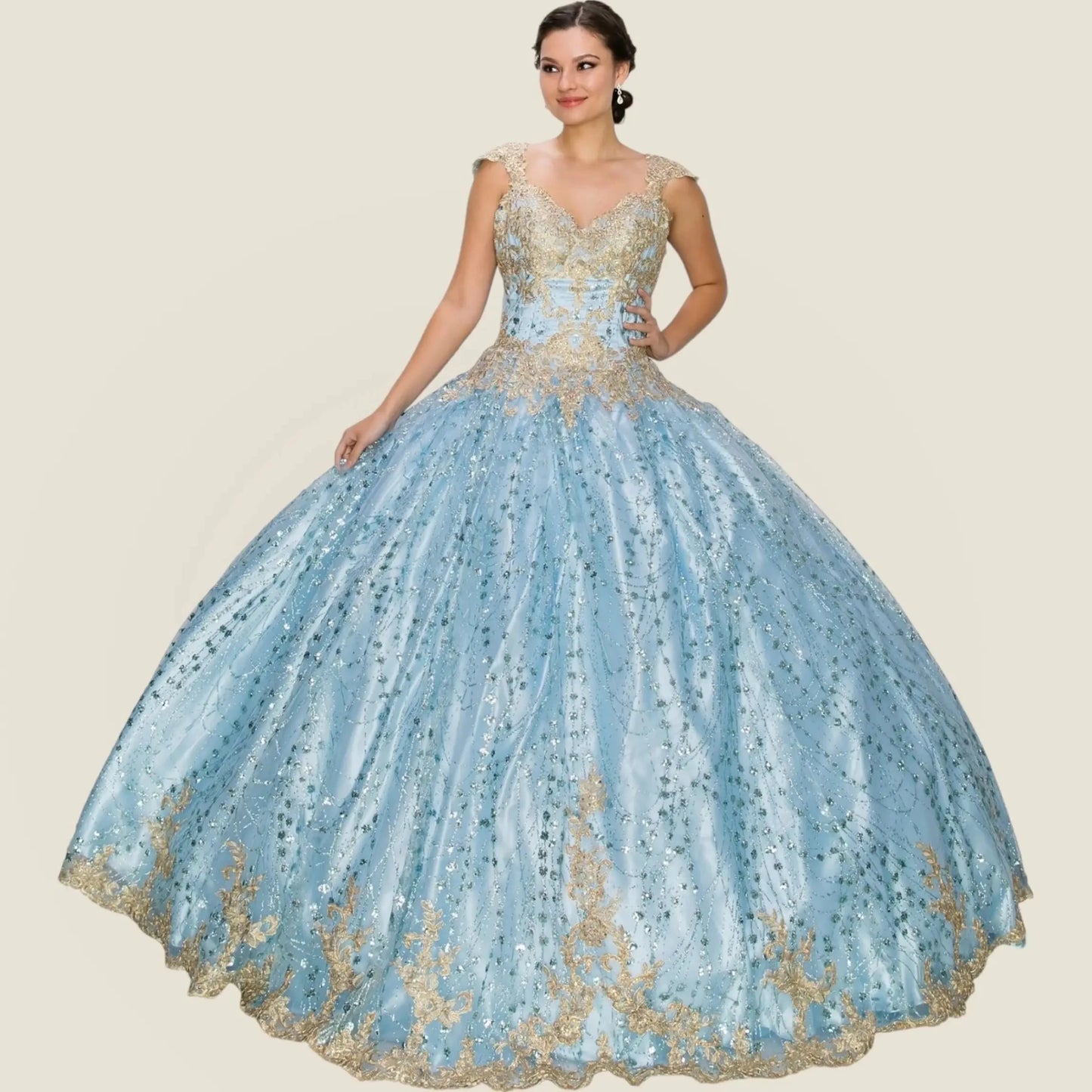 Woman wearing a blue and gold evening gown on a beige background