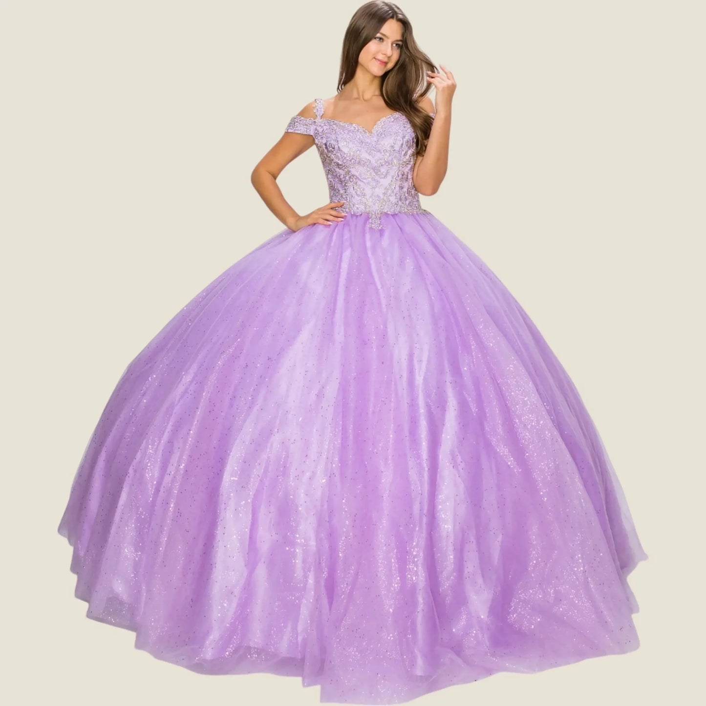 Front view of a woman wearing lavender quinceanera ball gown with lace bodice, gold detailing, and glitter tulle skirt