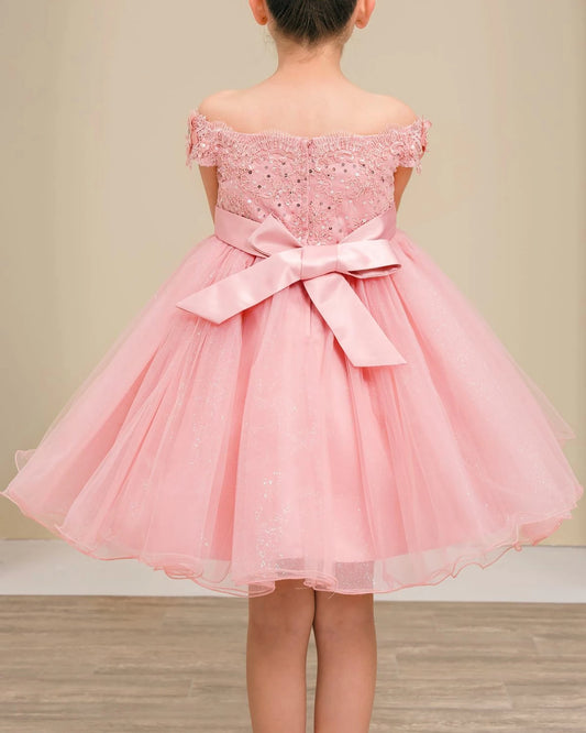 dusty rose off-shoulder dress with a bow on a neutral background