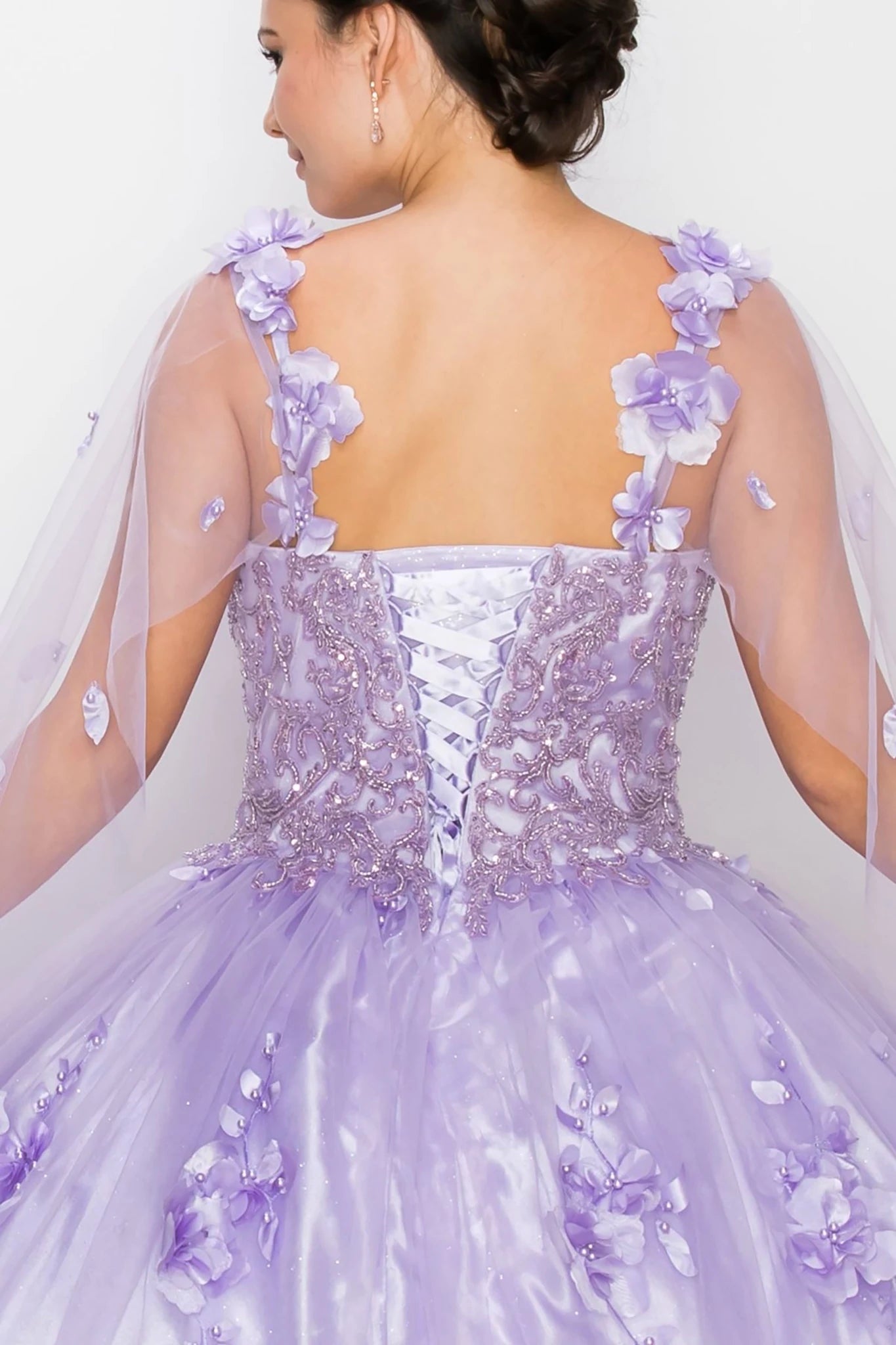 Lavender ball gown with floral details on a plain background