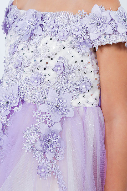 Close-up of a lilac flower girl dress with floral and bead details.