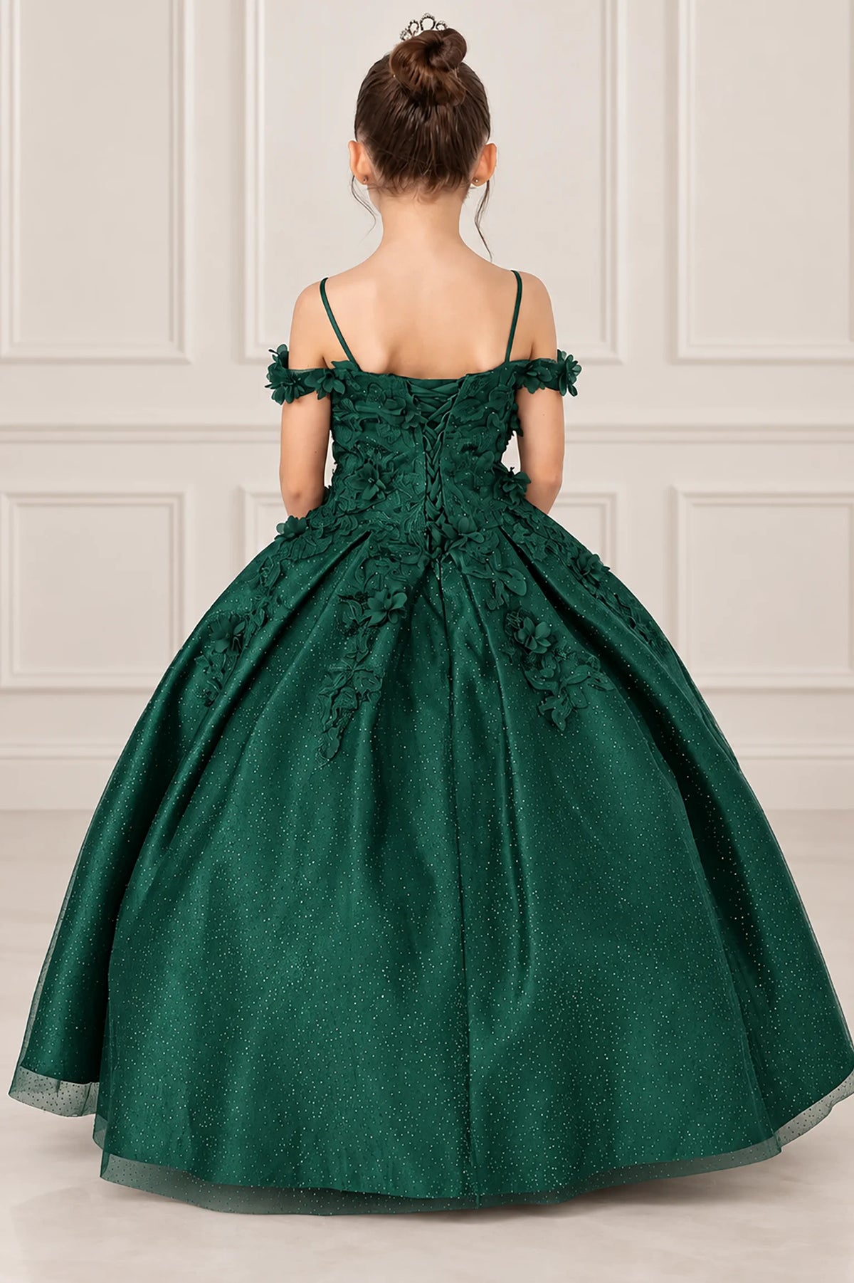 Lacing secures the back of the Hunter Green mini quinceañera dress, framed by narrow straps and floral trim.