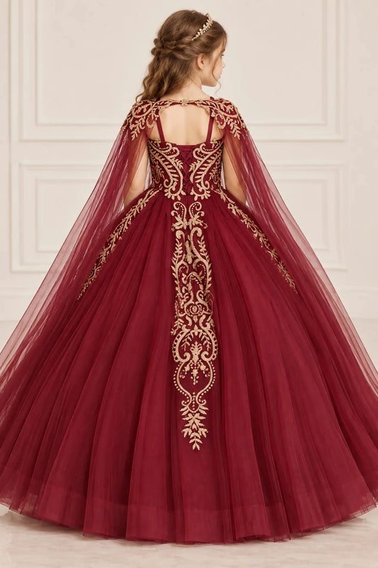 Flowing tulle frames the embroidered back panel and shoulder straps of the Burgundy mini quinceañera dress.