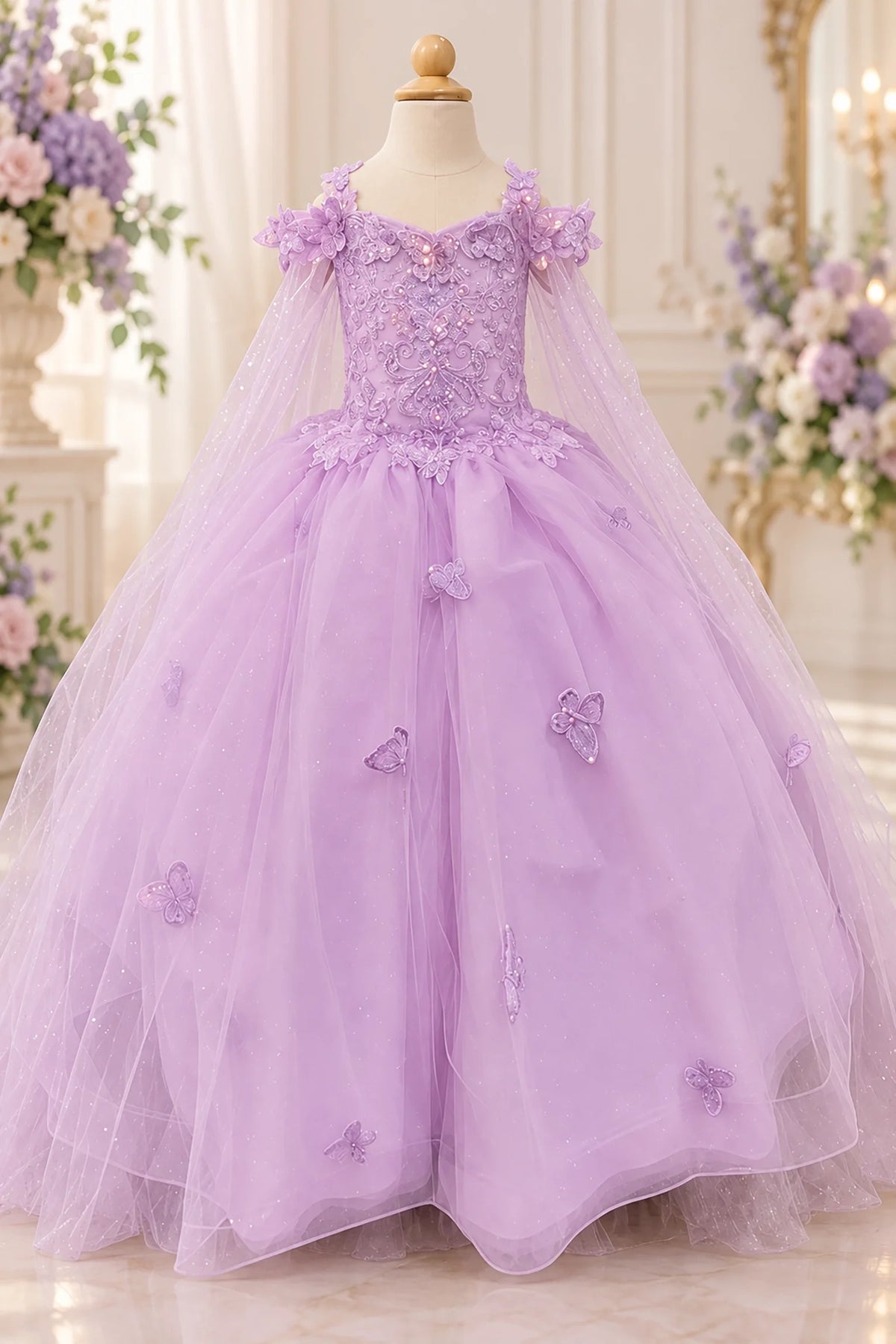 A closer front view of the Lilac mini quinceañera dress highlights its beaded floral bodice and sheer draped sleeves.