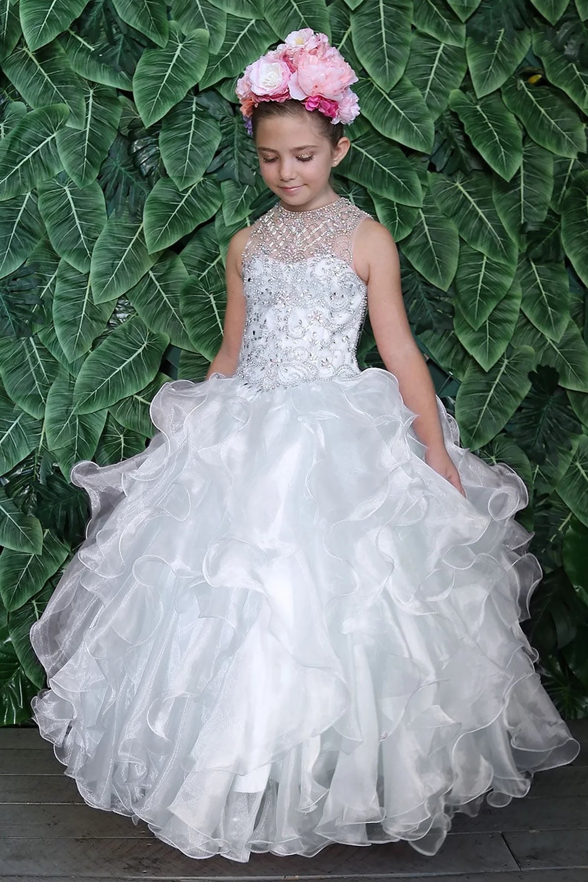 A closer crop highlights playful tiered organza ruffle skirt on the White mini quince dress.
