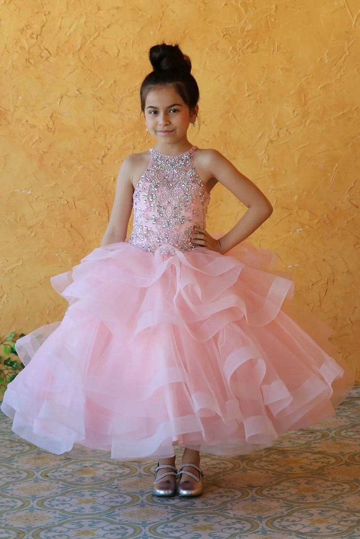 Another full view presents dimensional tiered ruffle skirt on the Blush Pink mini quince dress.