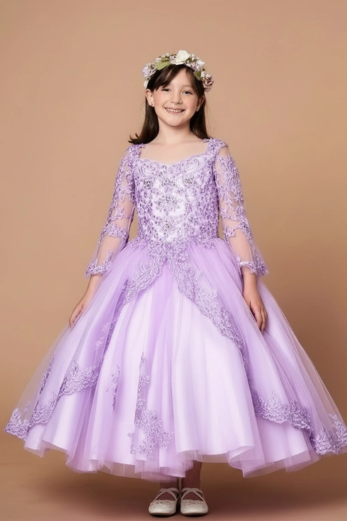 Rich texture defines, the Lilac mini quince dress showcases floral lace bodice with sheer long sleeves and full embroidered tulle ball gown skirt.