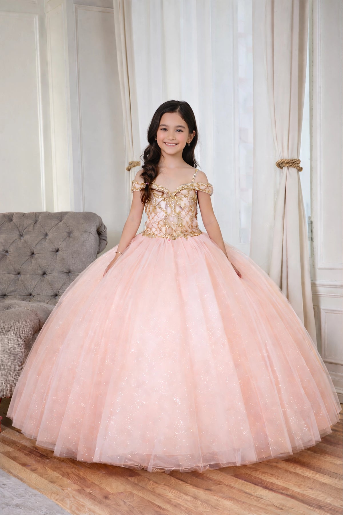 Sparkling details shape, the Blush/Gold mini quince dress showcases metallic embroidered off-the-shoulder bodice and full tulle skirt with coordinating two-tone detail.