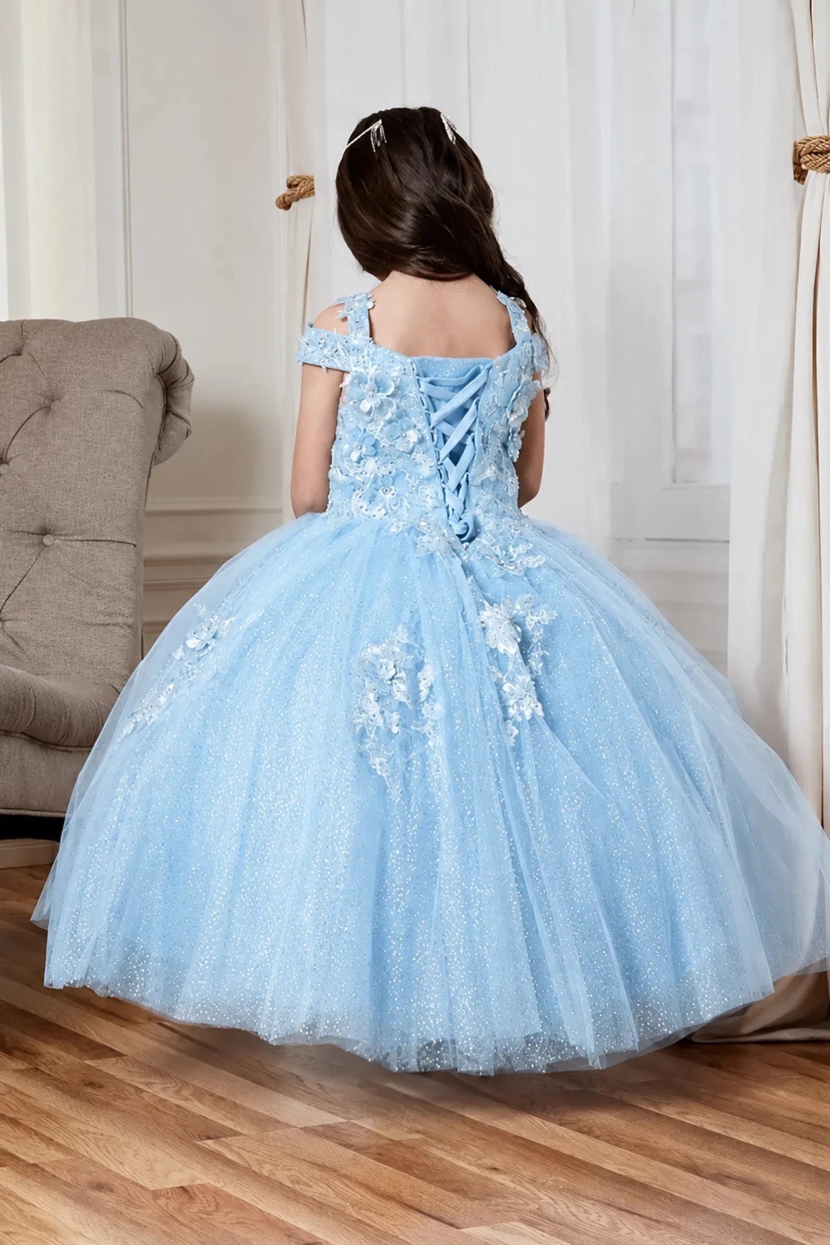 ight blue mini quince mini quince dress with floral lace appliqué and a lace-up back.