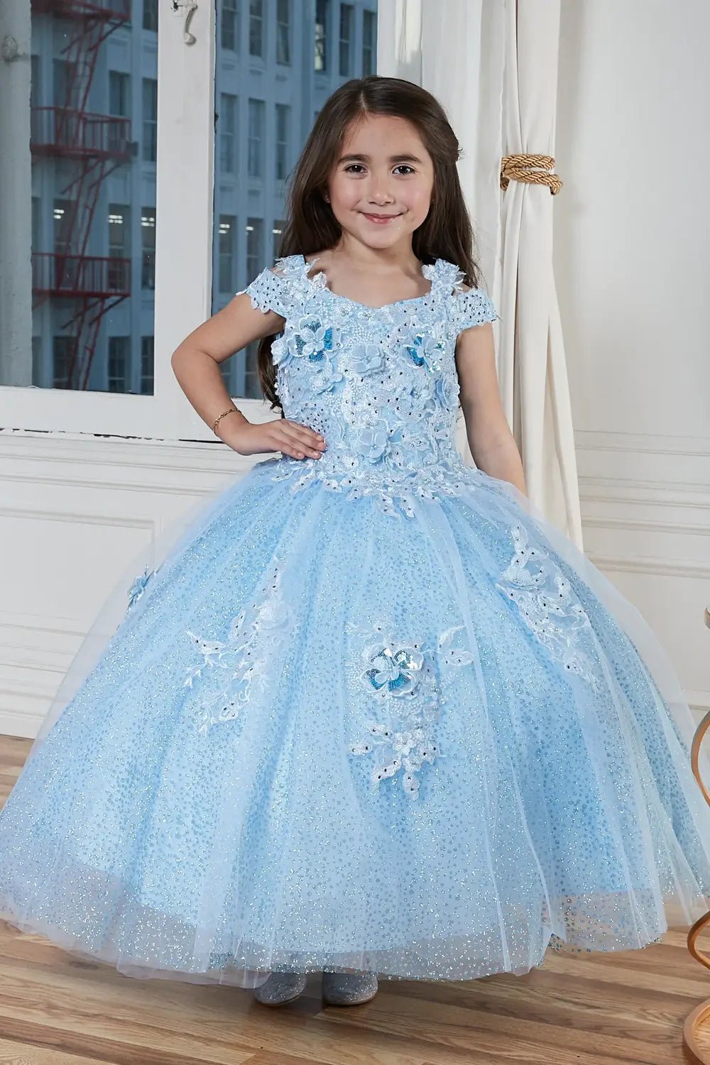 Kid standing front-facing in elegant sage ball gown with beaded 3D floral bodice and voluminous full skirt