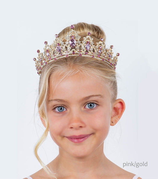 A child wearing a mini rhinestone pink gold tiara with a pinkish hue on a white background.